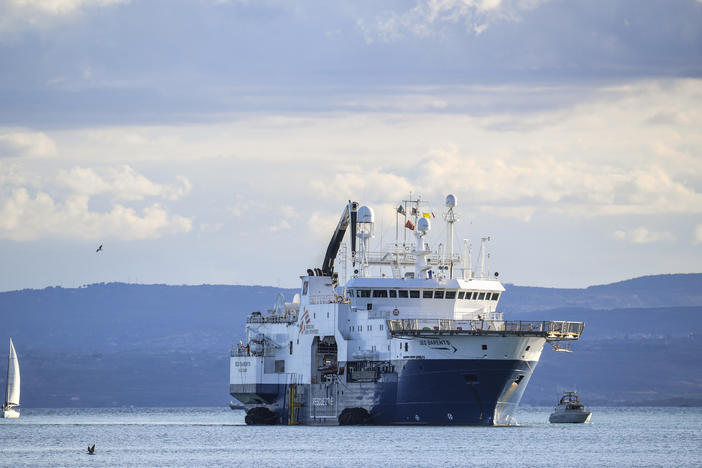 The Norway-flagged Geo Barents rescue ship carrying nearly 600 migrants arrives at Catania's port in Sicily on Sunday.