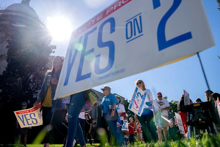 Attendees march during a rally encouraging voters to vote yes on Amendment 2, which would add a permanent abortion ban to Kentucky's state constitution at the state Capitol in Frankfort, Kentucky, on October 1, 2022.