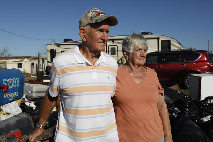 Jimmy Driggers and his wife Shirley pose for a portrait on Oct. 28, 2022 in Pine Island, Fla., where their home was severely flooded by a storm surge from Hurricane Ian in September.