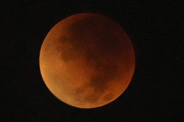 A total lunar eclipse graces the night skies during the first blood moon of the year, in Brasilia, Brazil, Sunday, May 15, 2022.