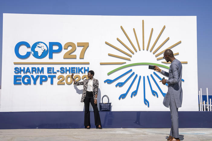 A Chadian poses for a photograph at the entrance of the COP27 U.N. Climate Summit on Sunday in Sharm el-Sheikh, Egypt.