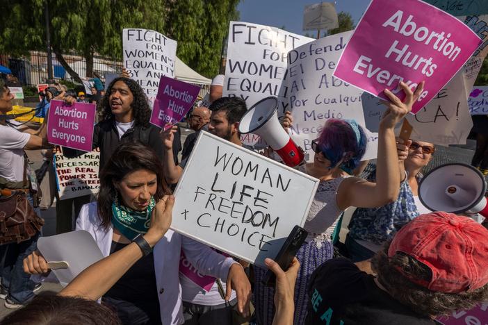 People argue as a group of anti-abortion rights protesters crashes the Women's March Action Rally for Reproductive Rights at Mariachi Plaza in Los Angeles on Oct. 8.
