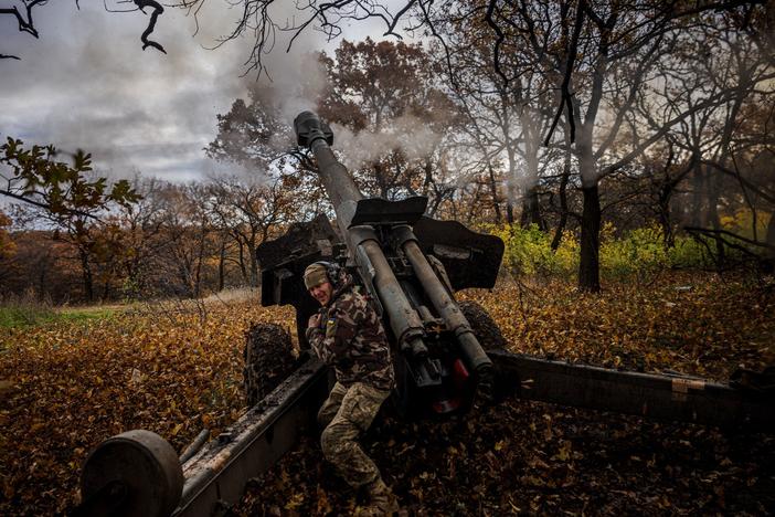 A Ukrainian artilleryman fires a howitzer at a position on the front line near Bakhmut, in eastern Ukraine's Donetsk region, on Oct. 31.
