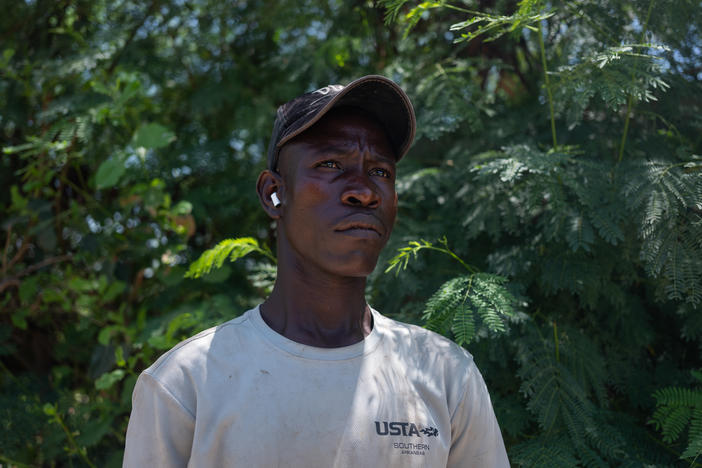 Sadio Konte Dior, 20, on the farm where he works outside of Dakar on October 4. He came to Senegal from Mali. On these small farms just outside of the capital, men and women who have migrated regionally grow lettuce and other vegetables.