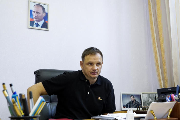 Kirill Stremousov, deputy head of the Russian-backed Kherson administration, in his office in Kherson on July 20. A portrait of Russian President Vladimir Putin is on the wall behind him.