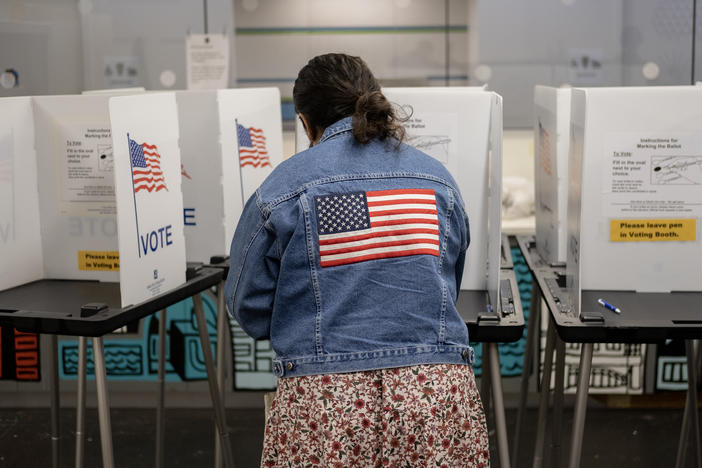 A voter casts their ballot at the Hillel Foundation on Tuesday in Madison, Wis.