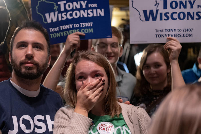 Supporters react during an election night event for Democratic Gov. Tony Evers at The Orpheum Theater on Nov. 8 in Madison, Wisc. Evers defeated Republican challenger Tim Michels Tuesday.
