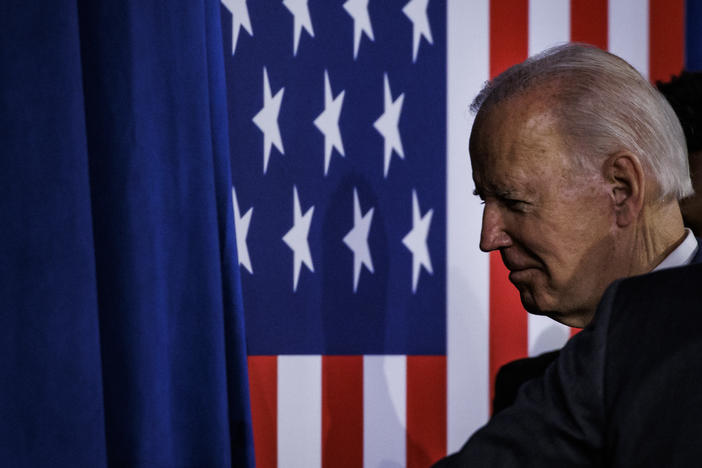 President Biden walks off stage after speaking at a rally to thank Democrats after the midterm election.