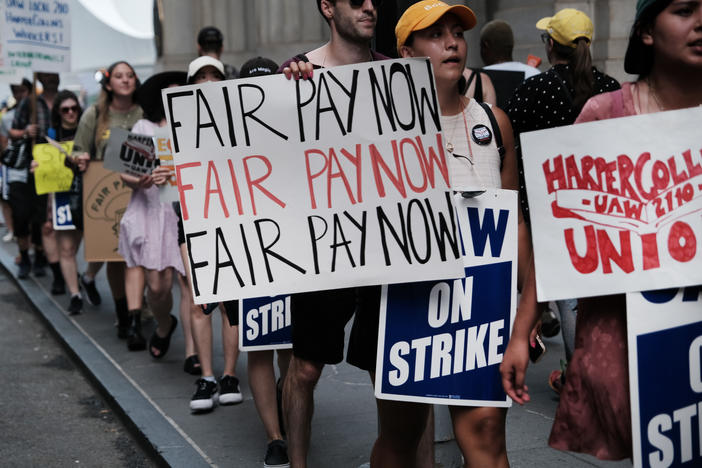 HarperCollins employees on a one-day strike earlier this summer. Workers have been in negotiations with the company since December 2021.