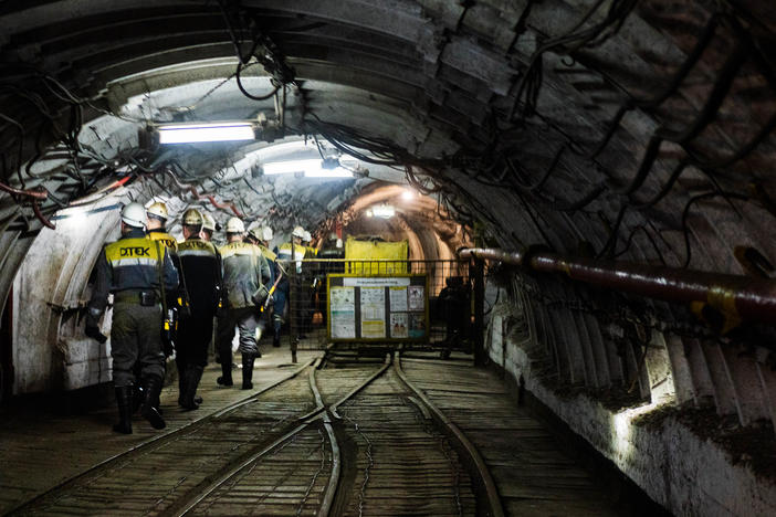 Workers at a coal mine in Ukraine start their shifts. Russia's invasion of Ukraine disrupted global supplies of fossil fuels and led to more reliance on coal for electricity in some countries.