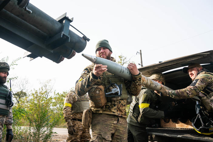 A group of Ukrainian soldiers from the Territorial Defense load a rocket under the cover of trees in Kherson Region in October. The approaching winter may force a change in tactics, Ukrainian military units and Western military analysts say.