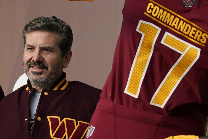 Washington Commanders' Dan Snyder poses for photos during an event to unveil the NFL football team's new identity, Feb. 2, 2022, in Landover, Md. Snyder and his organization are the subject of multiple ongoing investigations over workplace misconduct and potential financial improprieties.