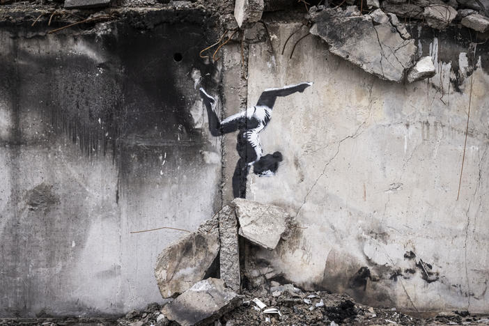 Graffiti of a woman in a leotard doing a handstand is seen on the wall of a destroyed building in Borodyanka on Friday in Kyiv Region, Ukraine. Banksy later confirmed on their Instagram account that this piece was their work.