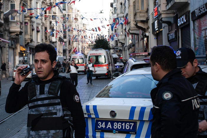 Emergency personnel investigate the scene of Sunday's deadly explosion that occurred on Istanbul's Istiklal Avenue, a busy pedestrian thoroughfare.
