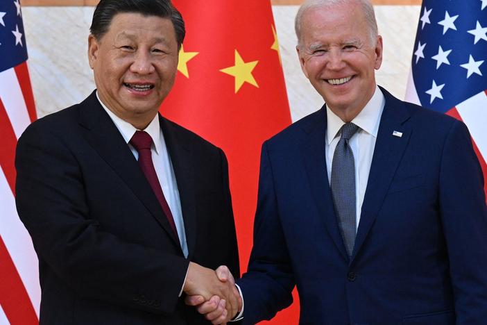 President Biden and China's President Xi Jinping shake hands as they begin talks in Bali.