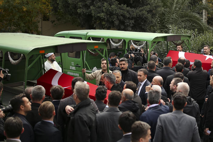 Relatives and friends of Arzu Ozsoy and her 15-year-old daughter Yagmur Ucar, who died in Sunday's explosion occurred on Istiklal avenue, attend their funeral in Istanbul, Turkey, Monday, Nov. 14, 2022.