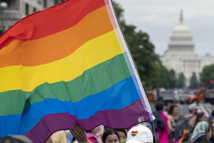 The Senate has voted to advance a bill that would protect same-sex and interracial marriages under federal law, setting the legislation on a path to final passage.
