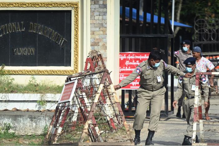 Prison security officials prepare for the release of inmates outside Insein prison in Yangon on November 17, 2022.