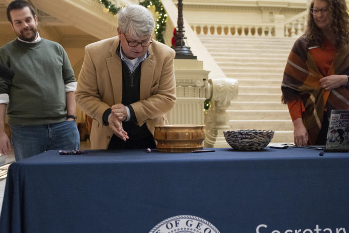 On Wednesday in Atlanta, Gabriel Sterling, chief operating officer for the Georgia secretary of state, rolls a 10-sided die as part of process to determine which batches of ballots to audit for a statewide risk limiting audit of the 2022 general election.