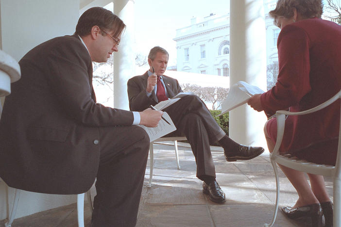 President George W. Bush prepares for his State of the Union Speech with Karen Hughes, Counselor to the President, and Michael Gerson, Director of Presidential Speech Writing, outside the Oval Office January 29, 2002 in Washington DC.