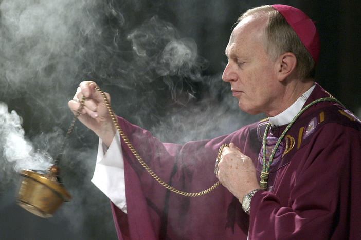 In this file photo, Bishop Howard Hubbard swings incense during an Ash Wednesday communion service at the Cathedral of the Immaculate Conception on Feb. 25, 2004, in Albany, N.Y.