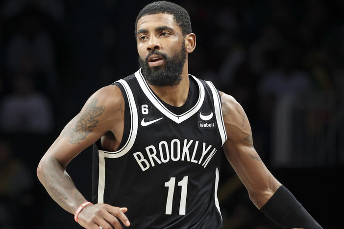 Brooklyn Nets guard Kyrie Irving  dribbles against the Chicago Bulls on Nov. 1 in New York. Irving has returned after a suspension.