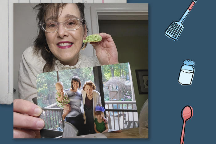 Allison Stines holds a photo of her family while she eats a family-favorite cookie: Martian droppings.