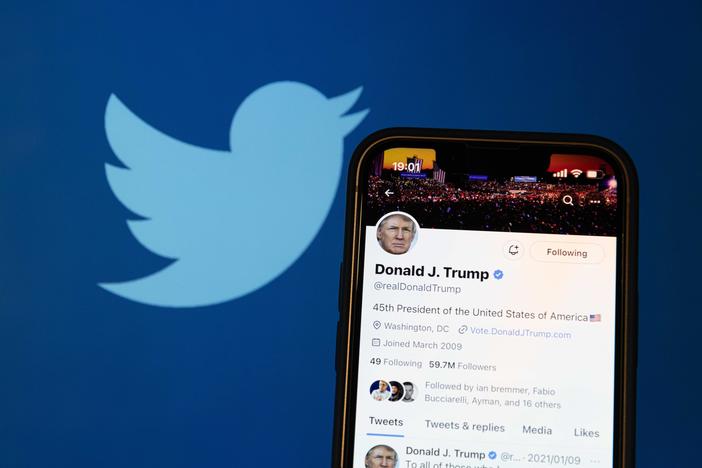 A photo illustration shows the reactivated Twitter profile of former US President Donald Trump. Elon Musk reinstated him on the social media platform on November 19, 2022.