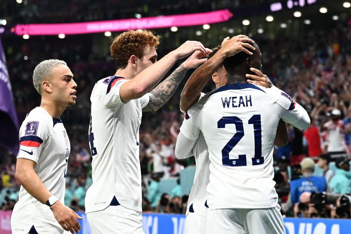 The U.S. men's national team celebrates after Timothy Weah's goal in the first half of a match with Wales in the FIFA World Cup.