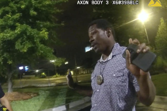 A still image from Atlanta Police body-worn camera footage showing Officer Garrett Rolfe speaking with 27-year-old Rayshard Brooks during their 40-minute encounter.