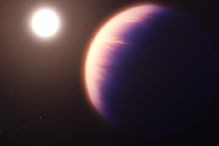 This illustration shows how the gas giant planet WASP-39 b might look as it orbits its host star.