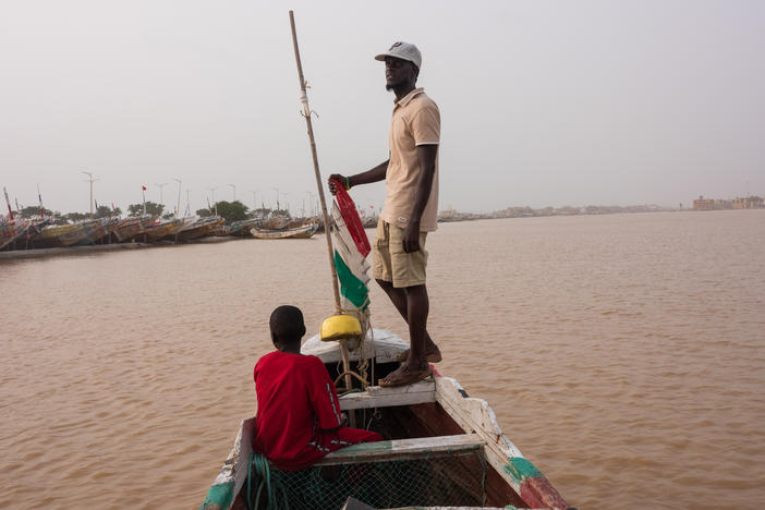 Moustapha Dieye on his boat in Guet Ndar, Senegal on October 5. Dieye took a pirogue to Spain in 2006, where he now legally resides. His family has a boat in Saint Louis, where he is originally from.
