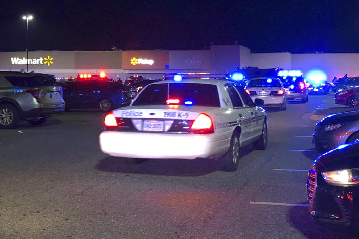 In this image from video Virginia police respond to the scene of a fatal shooting at a Walmart on Tuesday night in Chesapeake, Va.