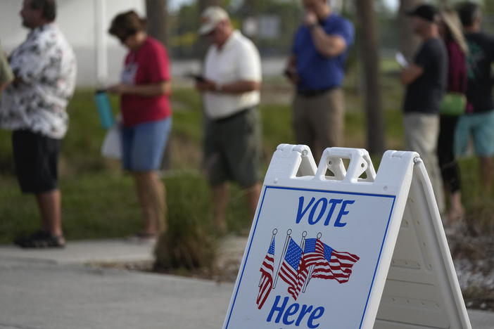 Lee County voters wait in line to cast their ballots at Wa-Ke Hatchee Recreation Center in Fort Myers, Fla., on Nov. 8.