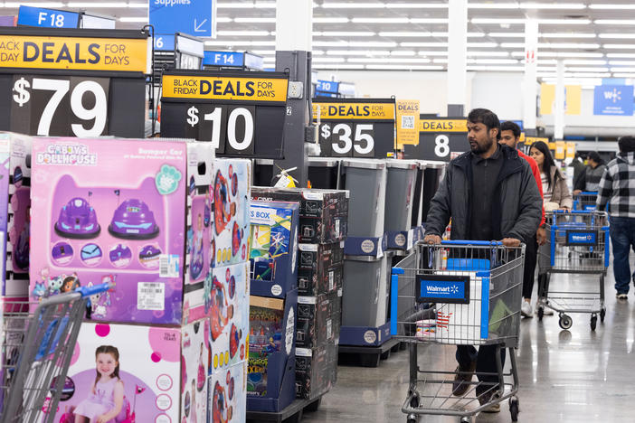 Shoppers walk the aisles of Walmart for Black Friday deals in Dunwoody, Georgia. Walmart opened at 6am on Black Friday for shoppers.