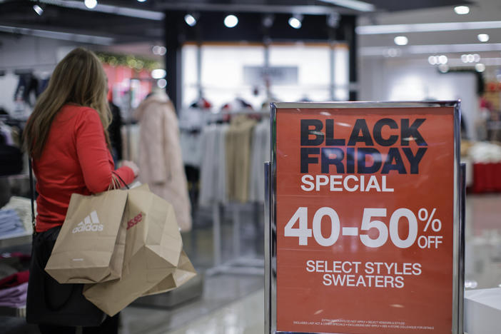 A shopper browses Black Friday sales at a Macy's store in Jersey City, N.J.