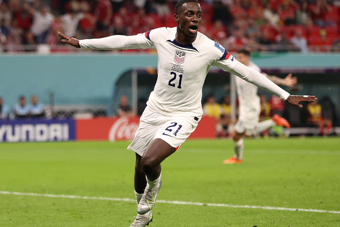 Tim Weah of the United States celebrates after scoring the team's goal during a World Cup match against Wales on November 21, 2022 in Doha, Qatar. Wales and the U-S finished 1-1.