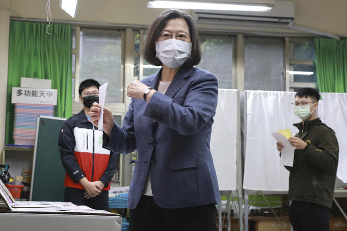 Taiwan President Tsai Ing-wen casts her ballots at a polling station in New Taipei City, Taiwan, on Saturday.