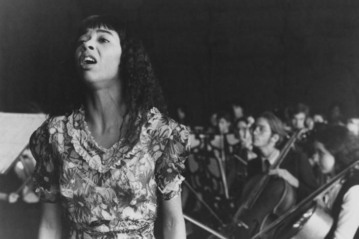 Coco Hernandez (Irene Cara) performs at a graduation ceremony in a scene from <em>Fame</em>, directed by Alan Parker, 1980.