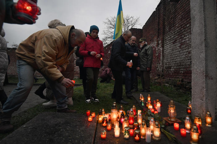 Residents hold a remembrance ceremony during the 90th anniversary of a great famine known as the Holodomor, at a museum in Drohobych, Ukraine, on Saturday.