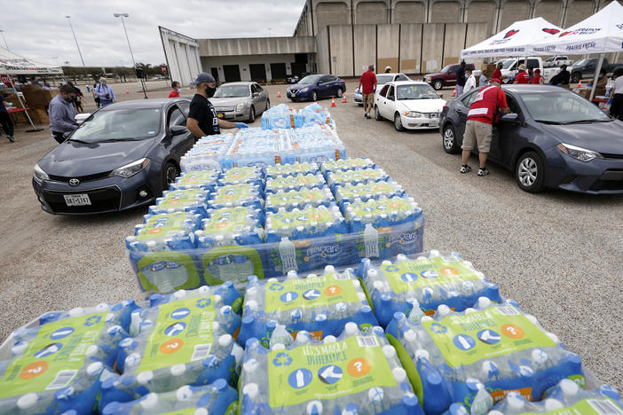 Volunteers distribute food and water Wednesday, Feb. 24, 2021, in Houston. The City of Houston, in collaboration with CrowdSource Rescue, Operation BBQ Relief and the Salvation Army served hot meals to those still impacted by Severe Winter Storm Uri.