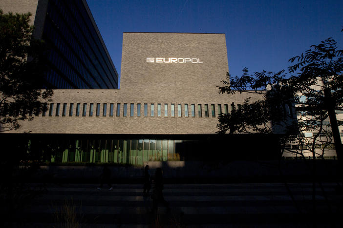 This Wednesday, Oct. 10, 2018, file photo shows the sun bouncing off the Europol headquarters in The Hague, Netherlands. Europol says law enforcement authorities in six different countries have joined forces to take down a "super cartel" of drugs traffickers controlling about one third of the cocaine trade in Europe.