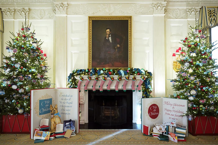 The State Dining Room of the White House is decorated for the holiday season with stockings for family members of President Biden and first lady Jill Biden.