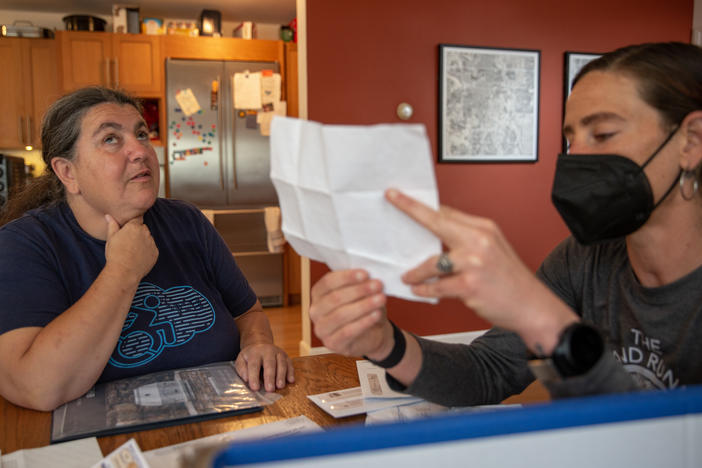 Lucy Greco (left), a web-accessibility specialist at the University of California, Berkeley, is blind. She reads most of her documents online, but employs Liza Schlosser-Olroyd as an aide to sort through her paper mail every other month, to make sure Greco hasn't missed a bill or other important correspondence.