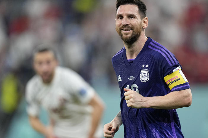 Argentina's Lionel Messi smiles during the World Cup group C soccer match between Poland and Argentina in Doha, Qatar, on Wednesday.