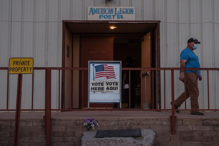 A man walks out after casting his vote on Election Day 2020 in Tombstone, Ariz., in Cochise County.