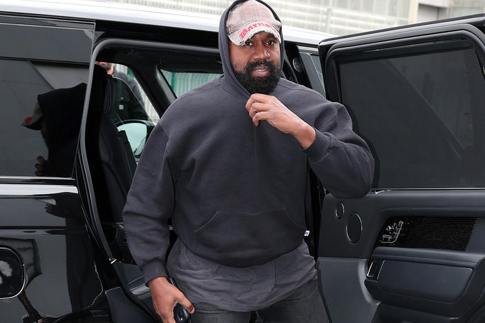 Ye attending the Balenciaga Womenswear show in October as part of Paris Fashion Week. Since then, he's made a string of increasingly brazen extremist comments.