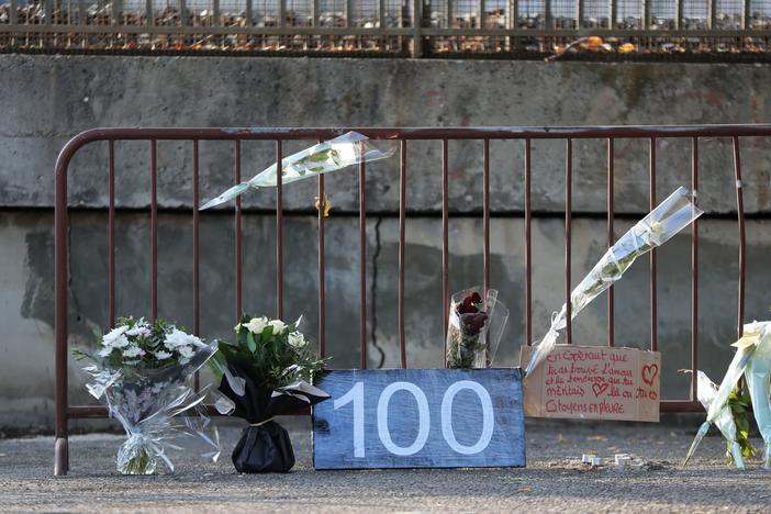 This "100" on a fence marks the site of the 100th victim of femicide in France in 2019.