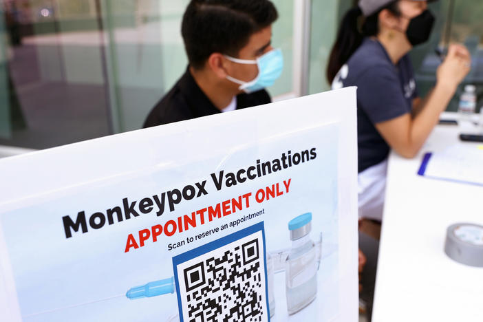 Health workers sit at a check-in table at a pop-up mpox vaccination clinic which opened today by the Los Angeles County Department of Public Health at the West Hollywood Library on August 3, 2022 in West Hollywood, California. California Governor Gavin Newsom declared a state of emergency on August 1st over the mpox outbreak.