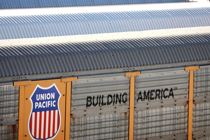 Freight rail cars sit in a rail yard in Wilmington, California, on November 22, 2022. This week, President Biden urged Congress to pass legislation to prevent a rail strike that could have brought trains to a halt nationwide.